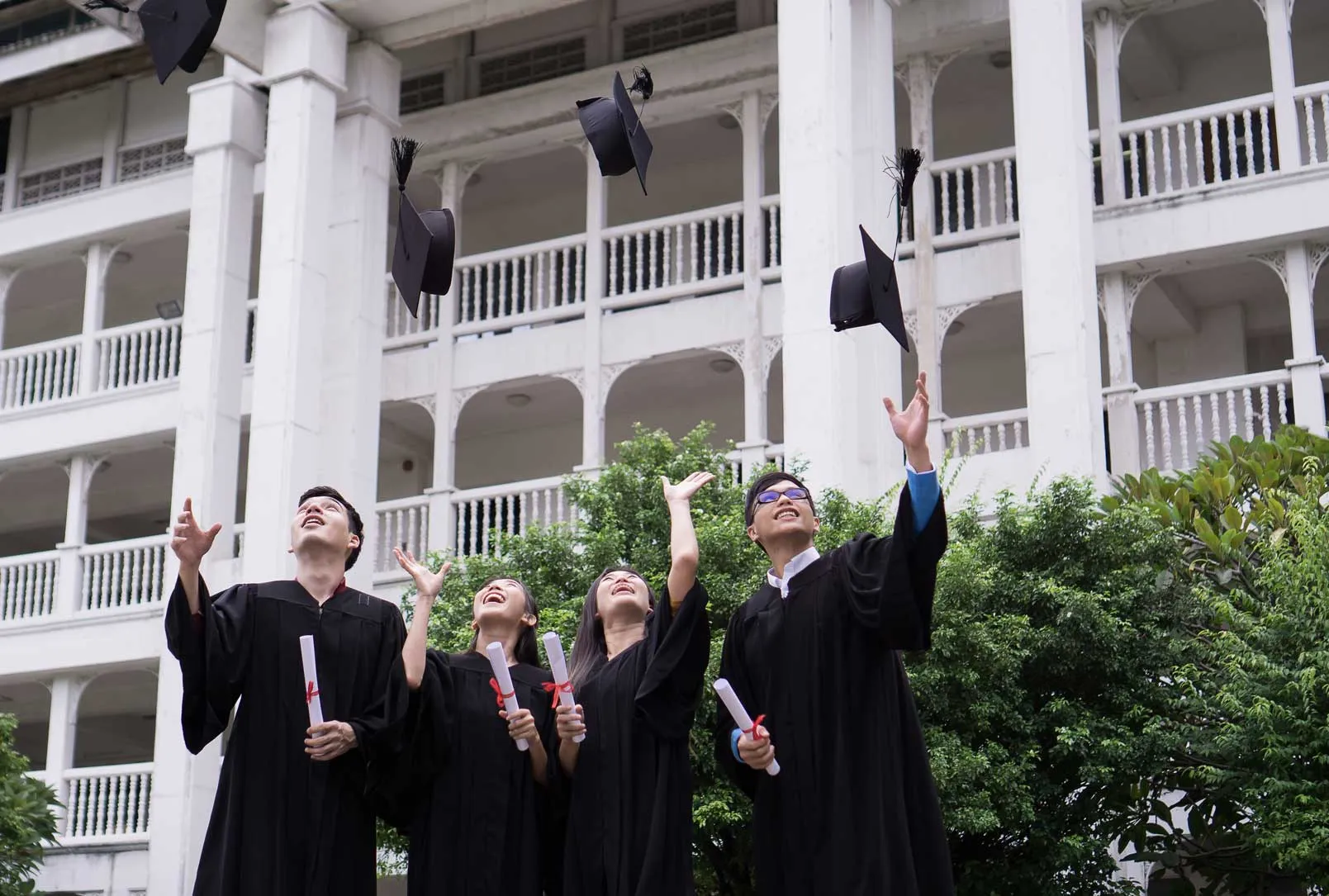 Graduates throwing their caps in the air